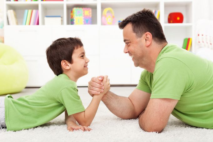bigstock Father and son arm wrestling a 34570973 681x454 1